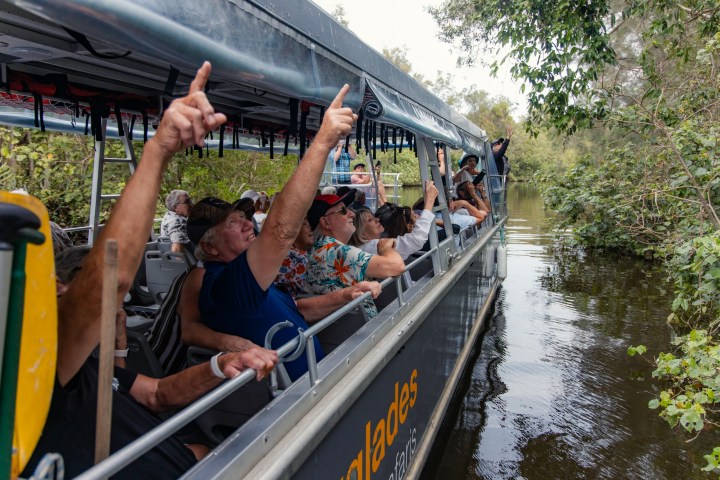 a man riding on the back of a boat