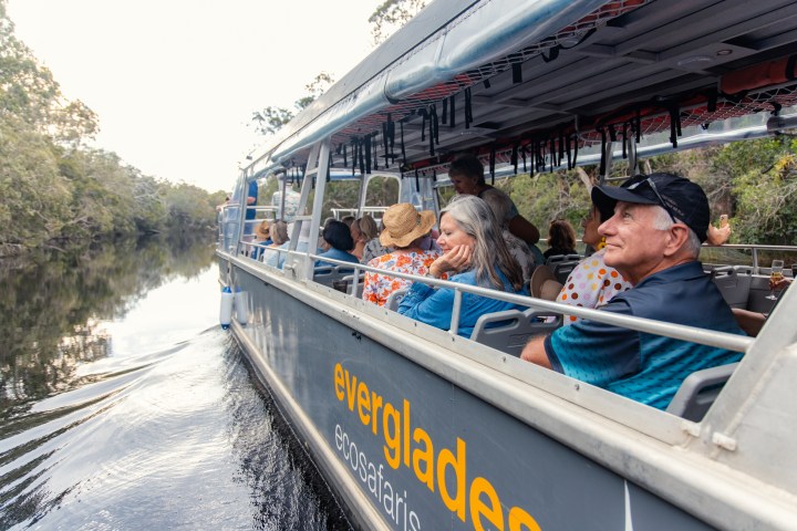 a person riding on the back of a boat
