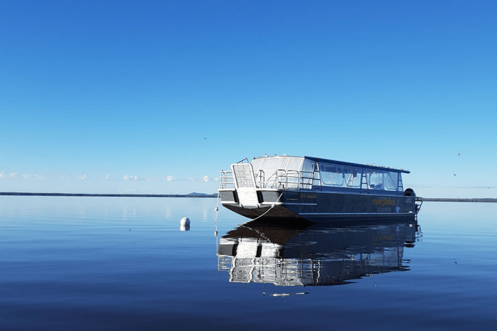 a small boat in a large body of water