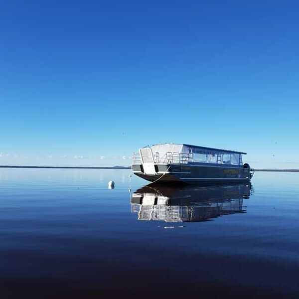 a small boat in a body of water