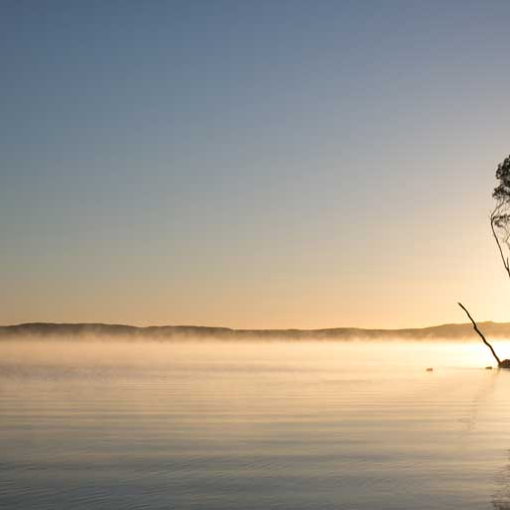 a sunset over a body of water